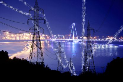 Small Town Electrification at Night in Blue Stock Image