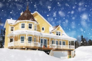 Cozy Modern Yellow House with Light Snow Fall Stock Image