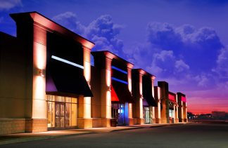 Modern Strip Mall at Night Stock Image